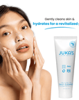Woman using JUKA'S Daily Facial Cleanser on her face