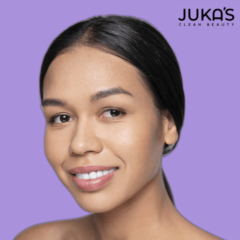 A woman showcasing radiant skin demonstrating natural nourishment for your skin with Jukas Clean Beauty.