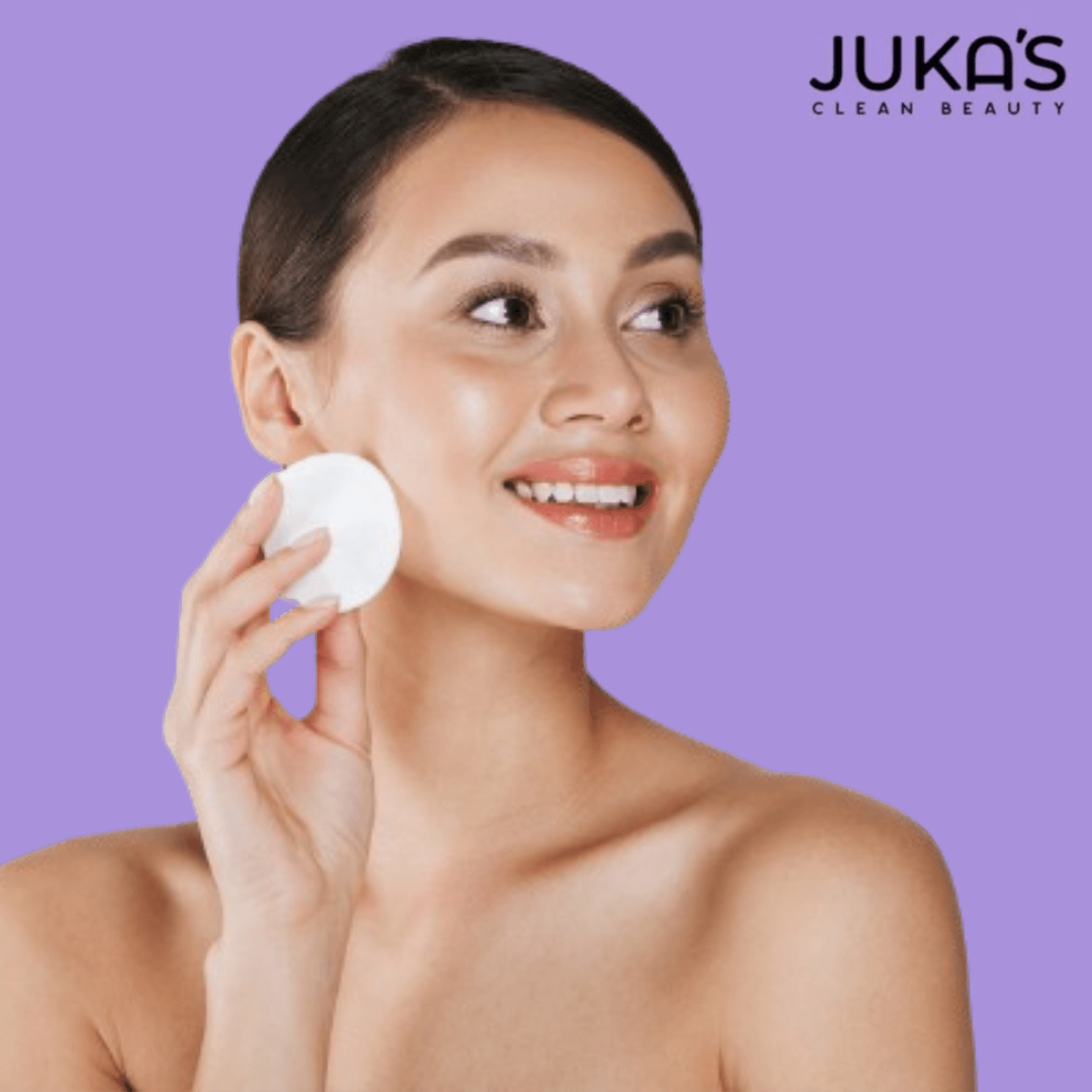 Woman using skincare products for natural glow, showcasing Juka's Clean Beauty.