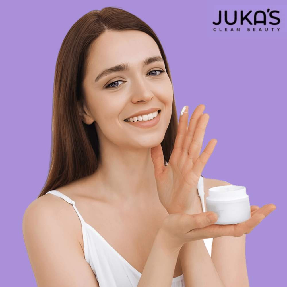 Radiant Skin with Juka's Vegan Moisturizer displayed by a smiling woman holding a jar of moisturizer.