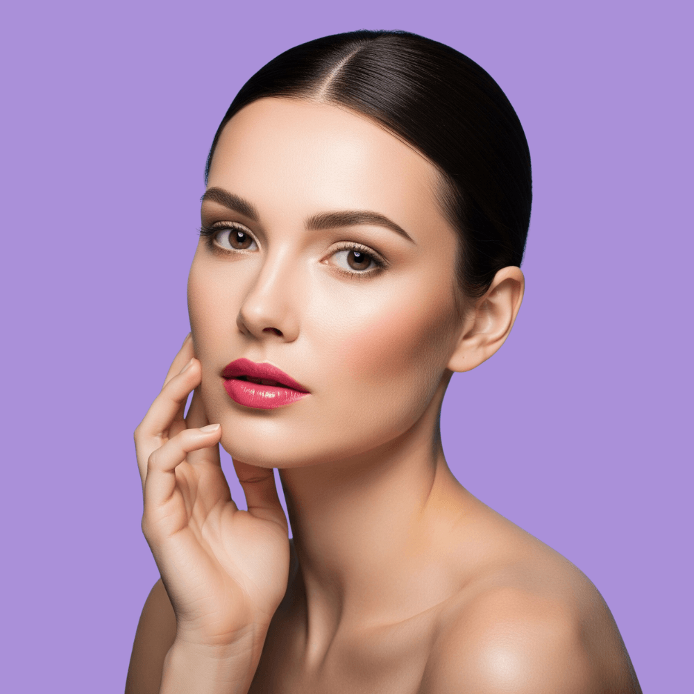 Woman showcasing bright skin, revealing effects of Kojic acid in the Hyper Glow Kit for dark spots.