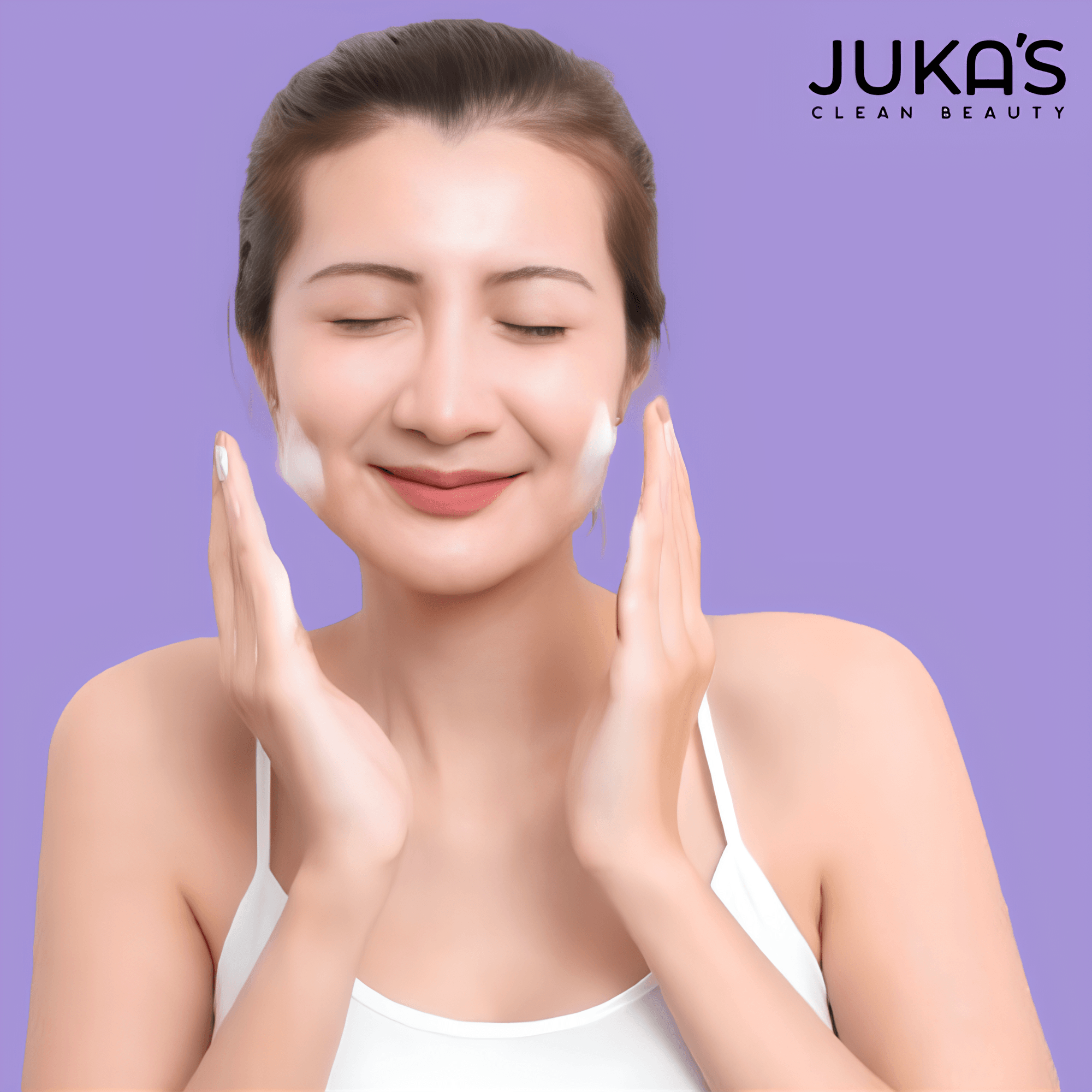 Woman using glycolic acid cleanser for daily skincare routine with a joyful expression.