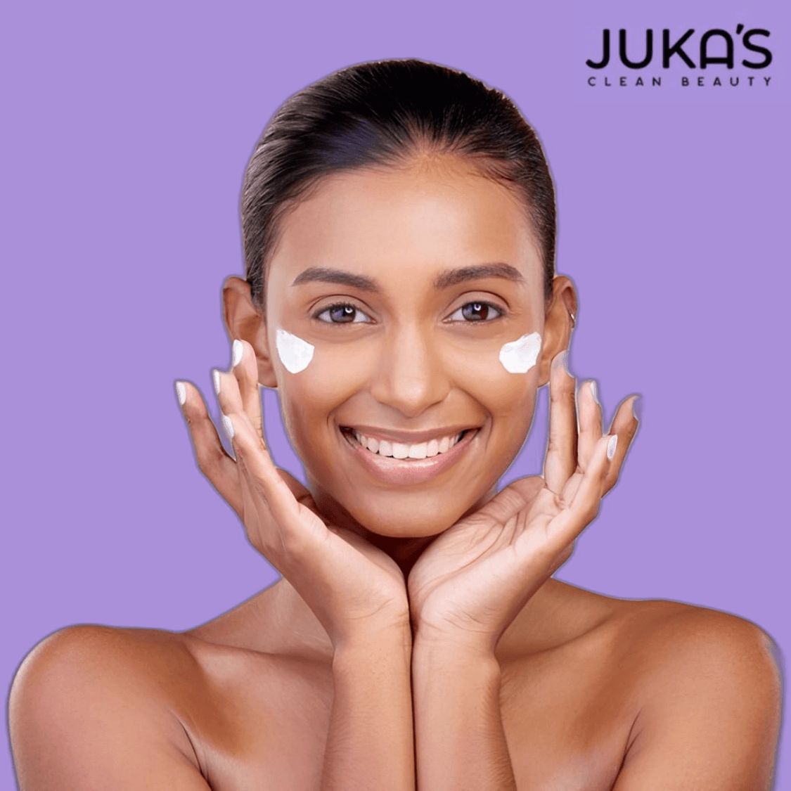Woman applying Juka's vegan moisturizer for normal & dry skin, showcasing the benefits of Juka's Vegan Moisturizer.