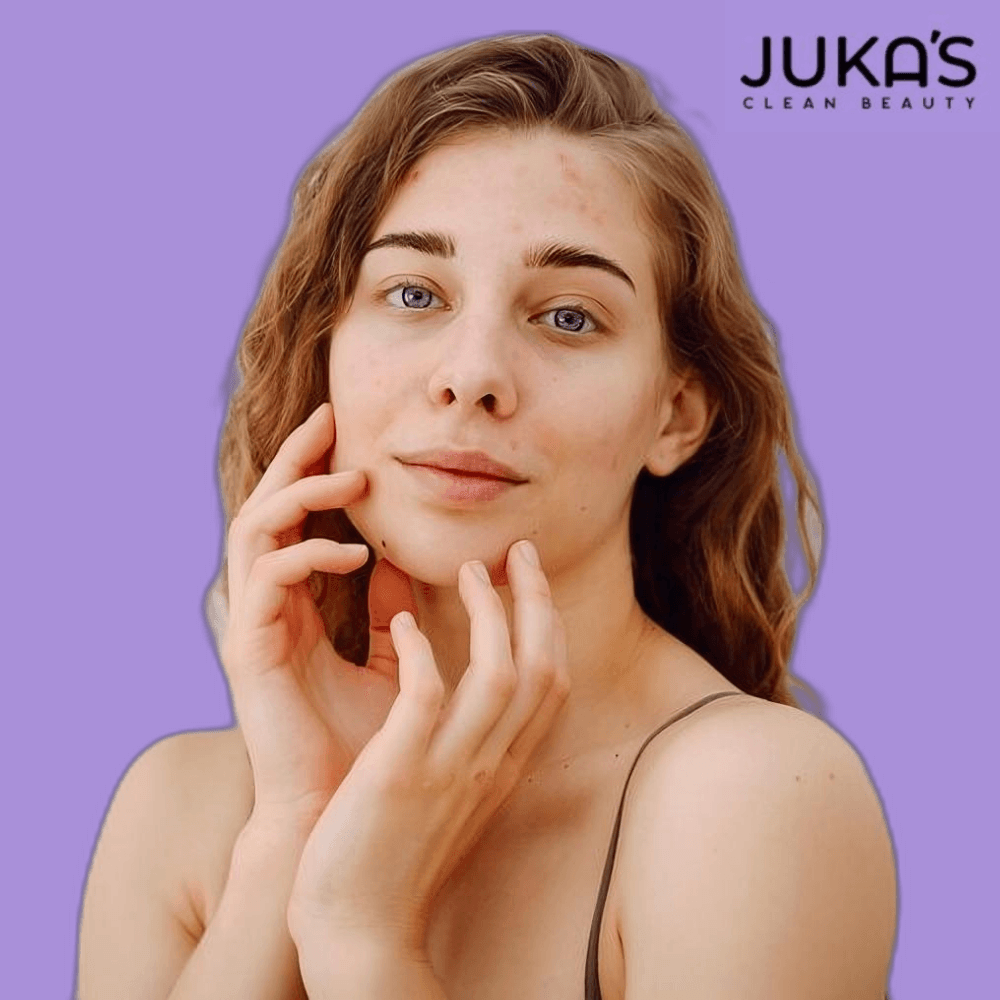 Woman applying Juka's vegan facial mask for pure skincare on her face, showcasing natural beauty.